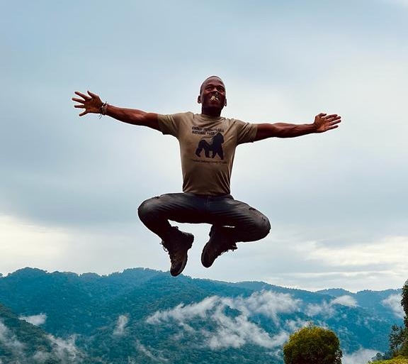 Simon leaping in air Uganda. Elena, Beatriz, Sophie photo
