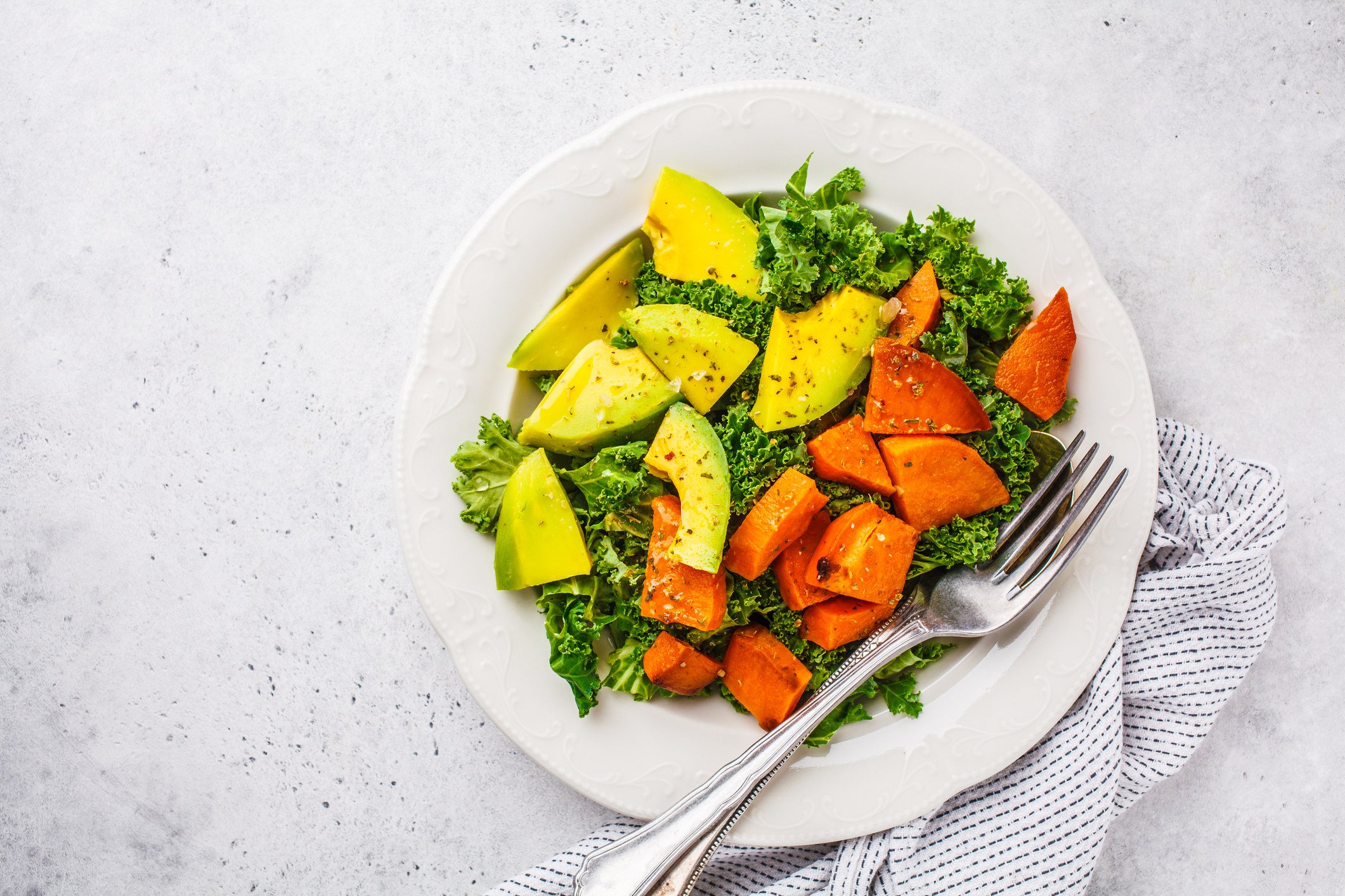 Ours. Salad of kale, sweet potatoes and avocado