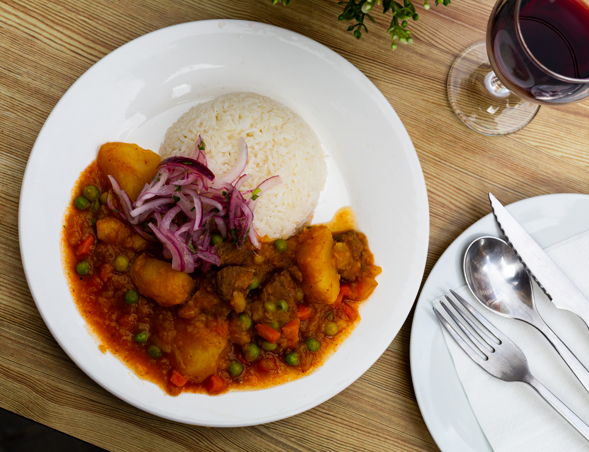 Spicy Peruvian meal of rice, potatoes, peas and veal