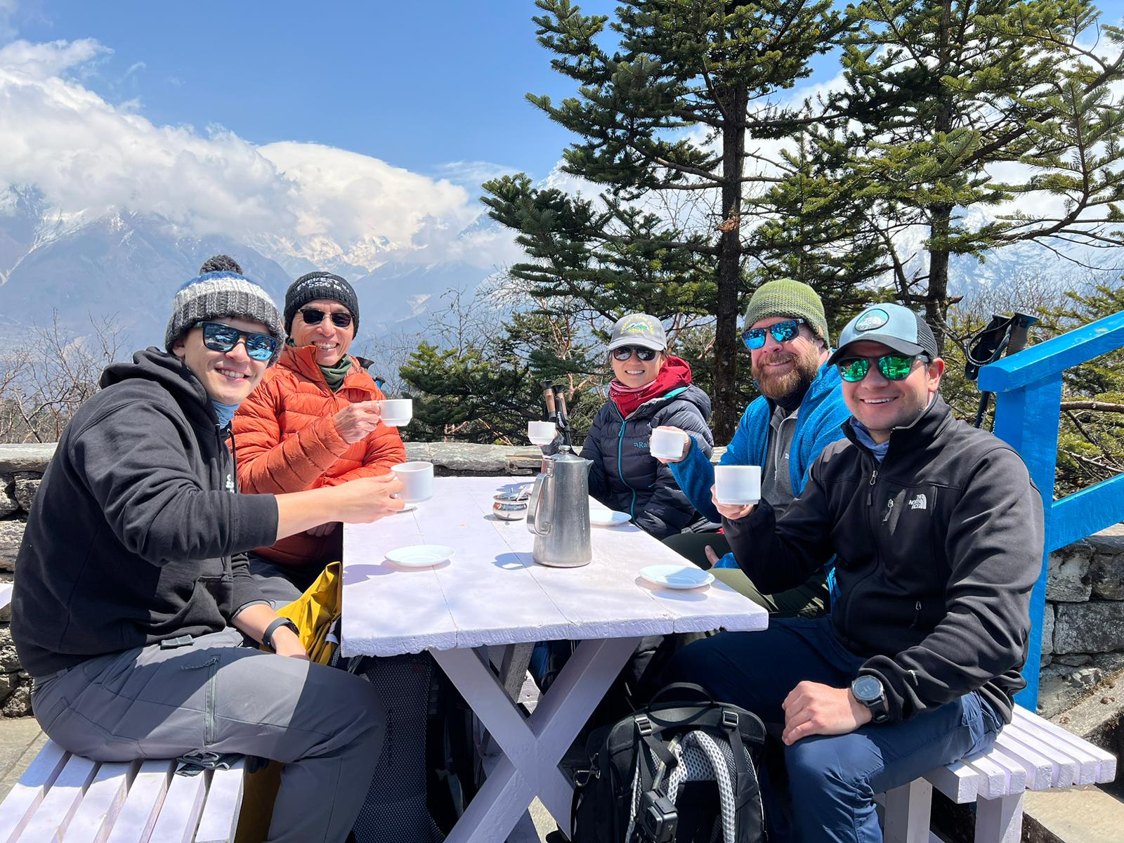 Kevin. Nepal EBC trek, group pic hot drinks outdoors restaurant