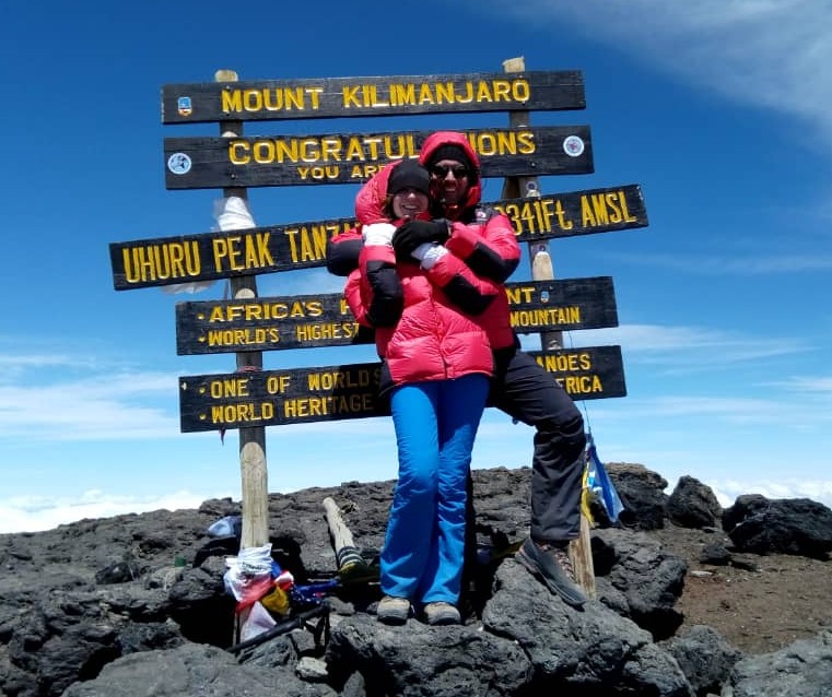 Couple by Uhuru Peak sign