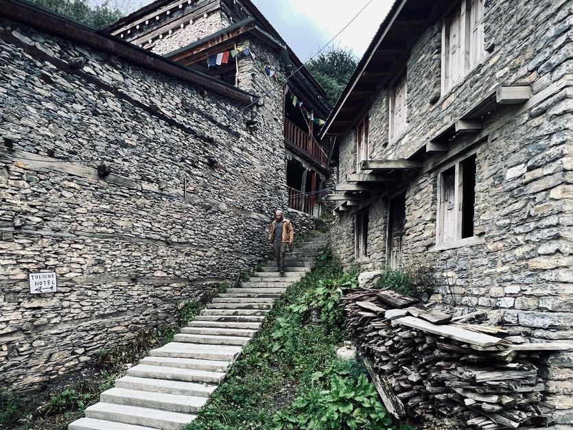 Hala Macknight. Annapurna Circuit, steps between stone buildings in village