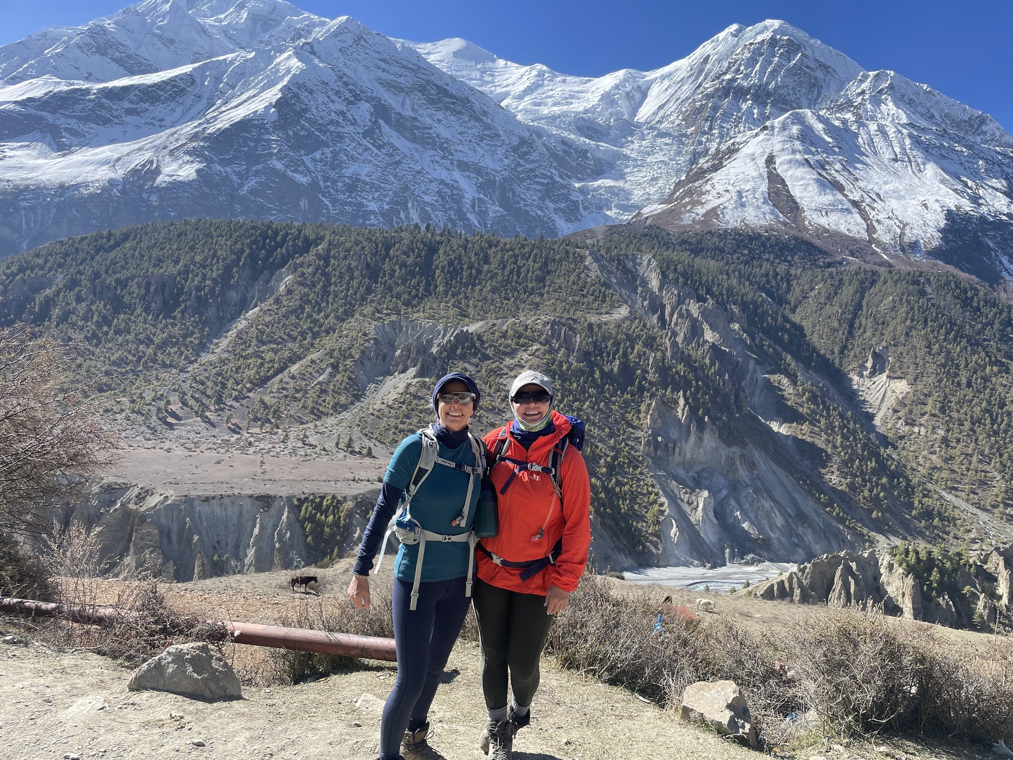 Vonie and Amanda. S. Annapurna Circuit. Mountains and forest