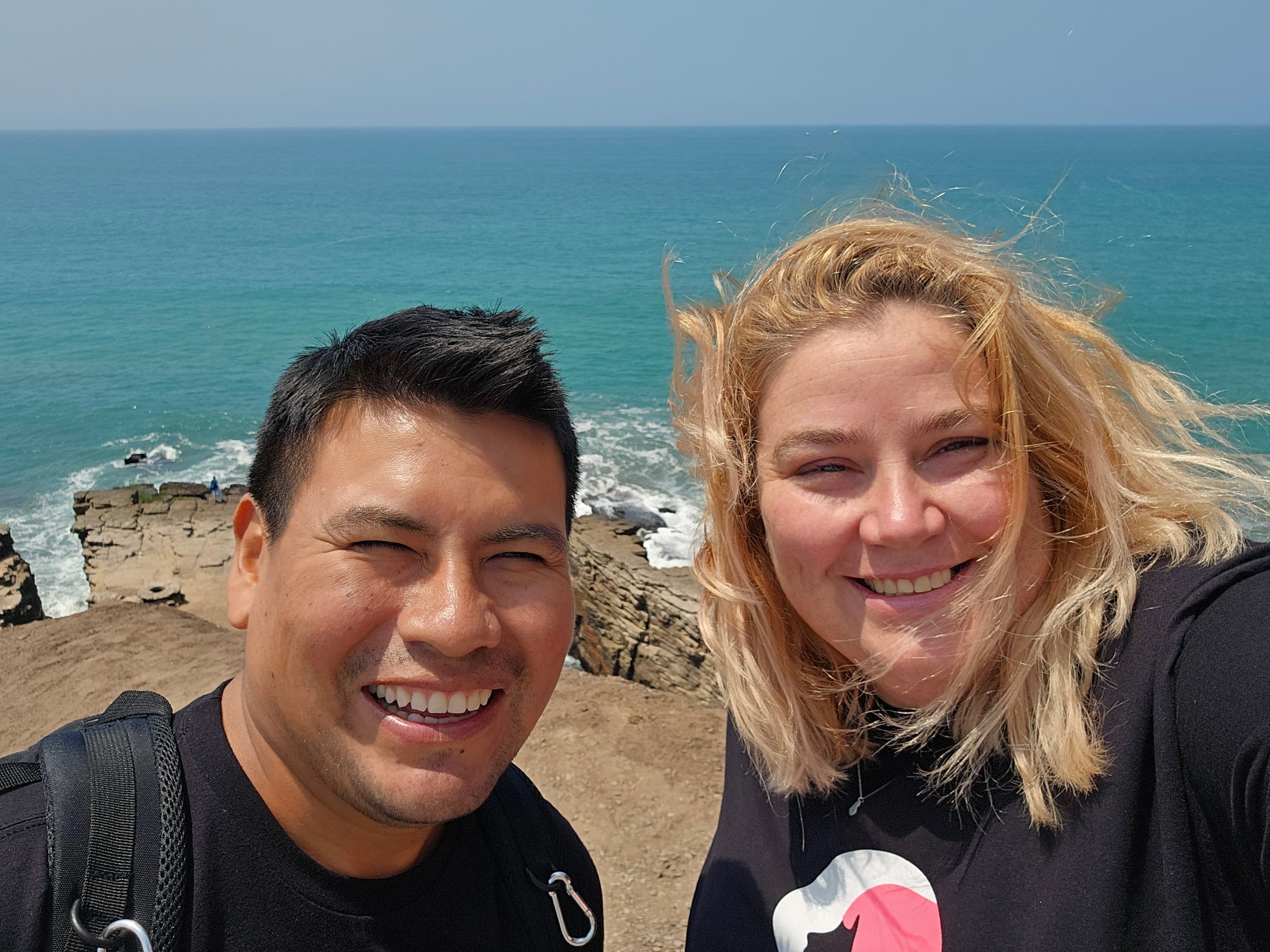 Lexy and Arturo selfie by sea in Lima, Peru