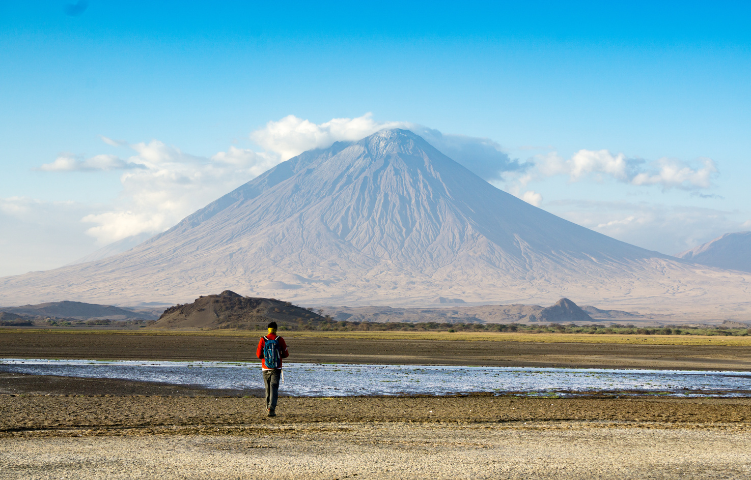 Ours. S. Hiker in front of Ol Doinyo Lengai