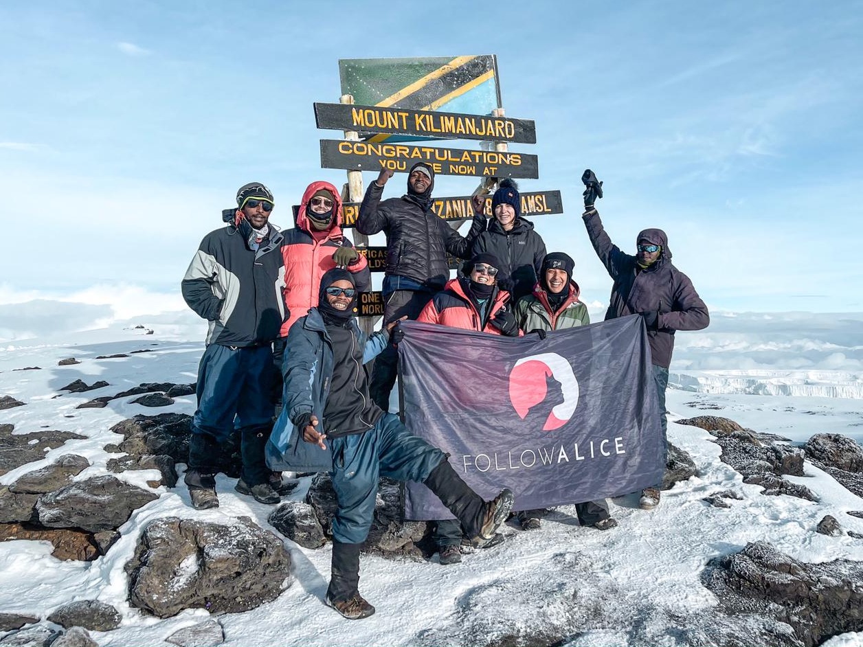 Kilimanjaro group pic summit Uhuru Peak FA flag