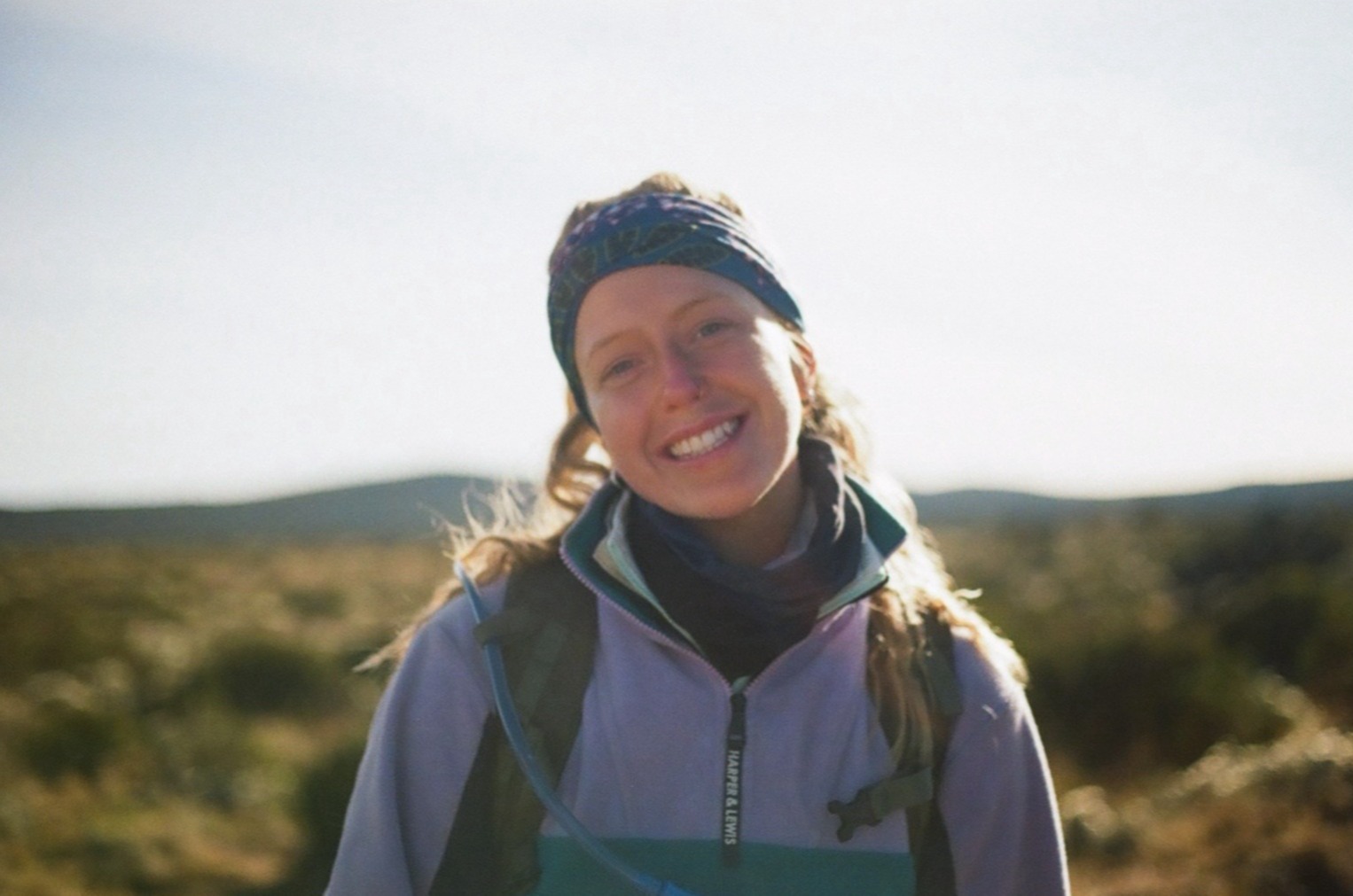 Jillian Tofukuji. Smiling female hiker on Kilimanjaro