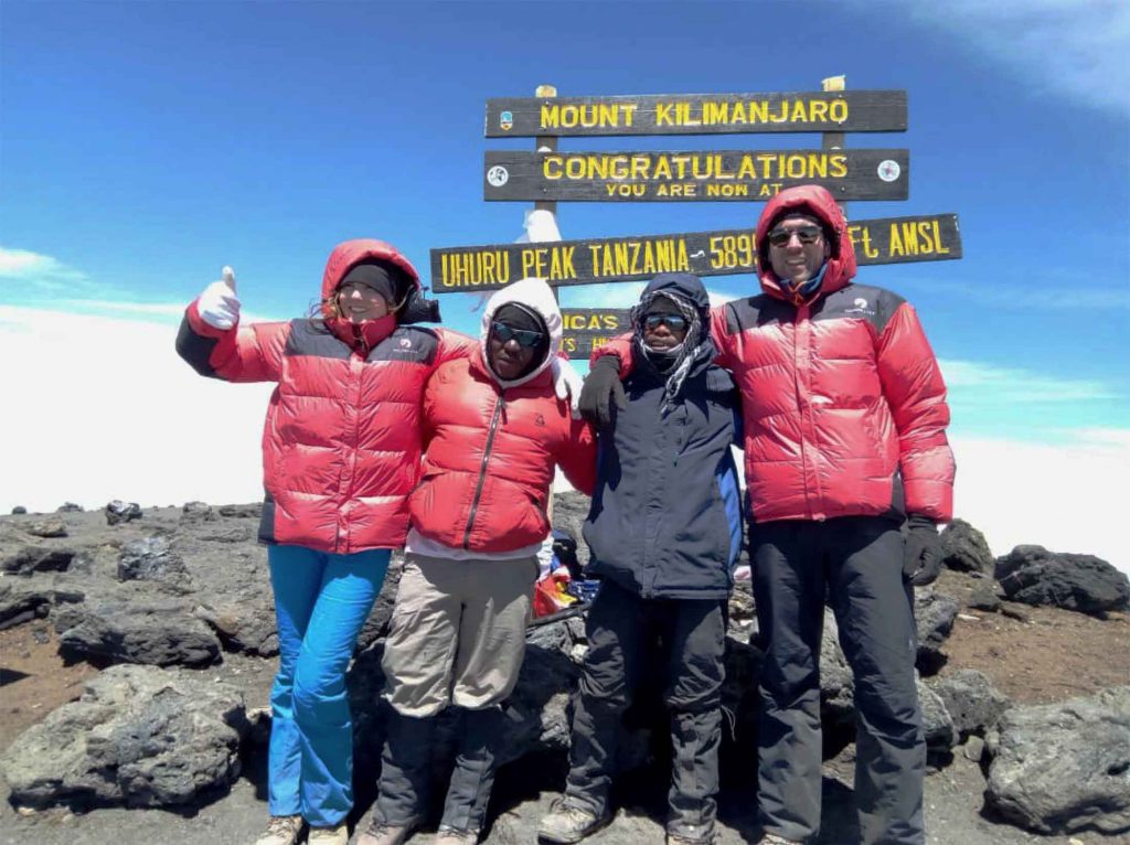 Friends_Reach_Summit_Mount_Kilimanjaro-1024x766.jpg
