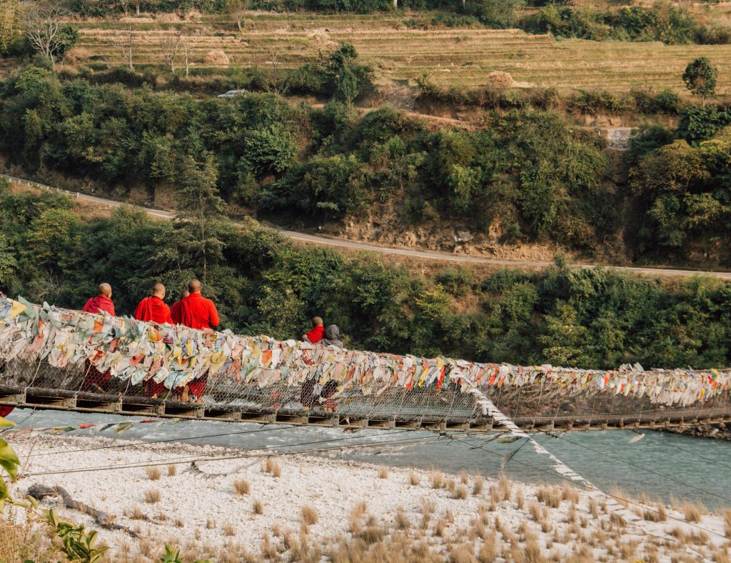 Monks-walking-across-Punakha-Bridge-Bhutan-1-1024x788.jpg
