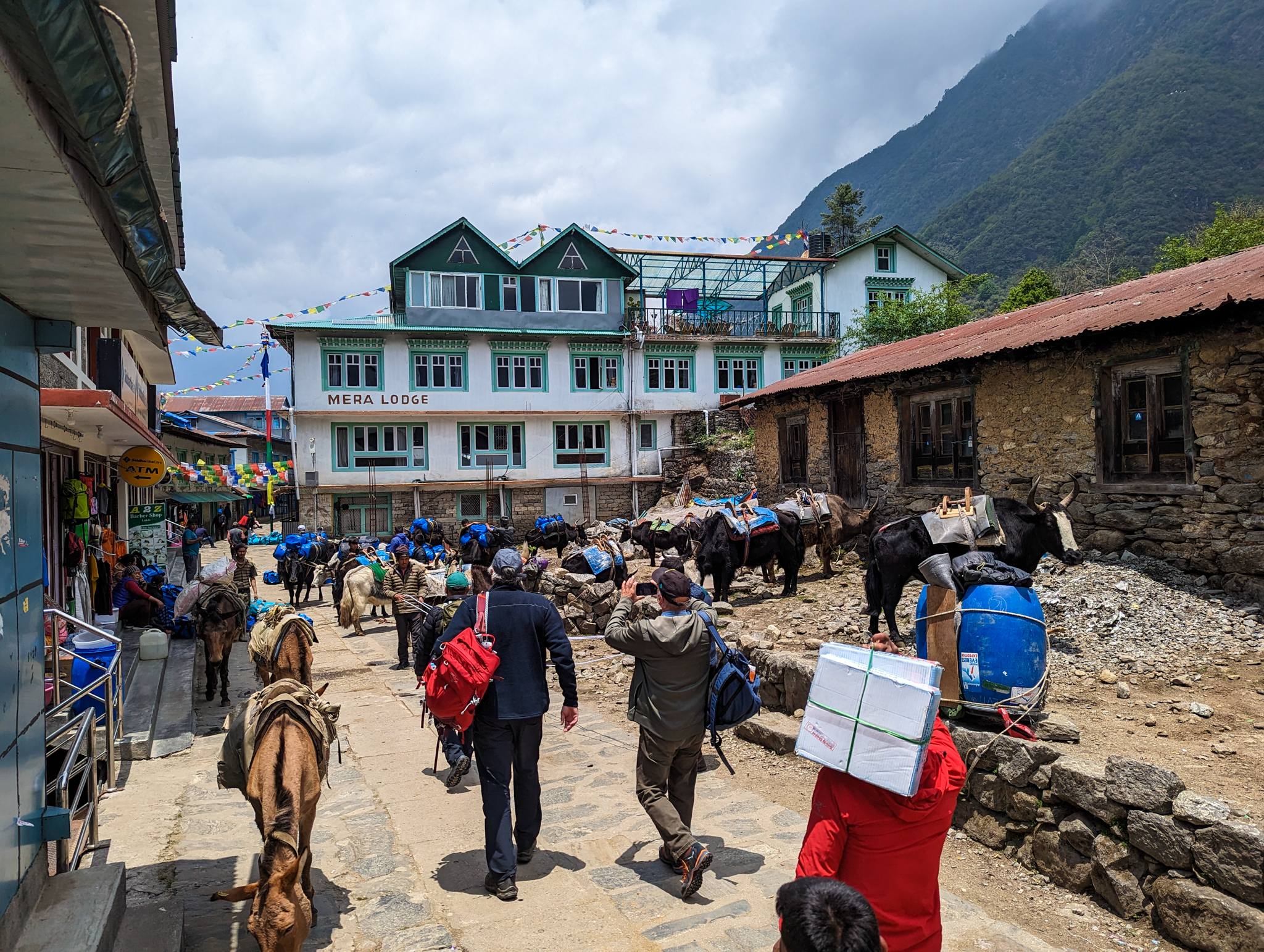 Clovis. Trekkers walking into Namche Bazaar. EBC trek, Nepal