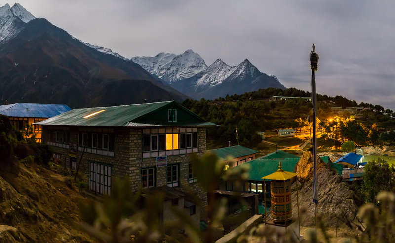 Ours. Dusk over Namche Bazaar, lights turned on in teahouses