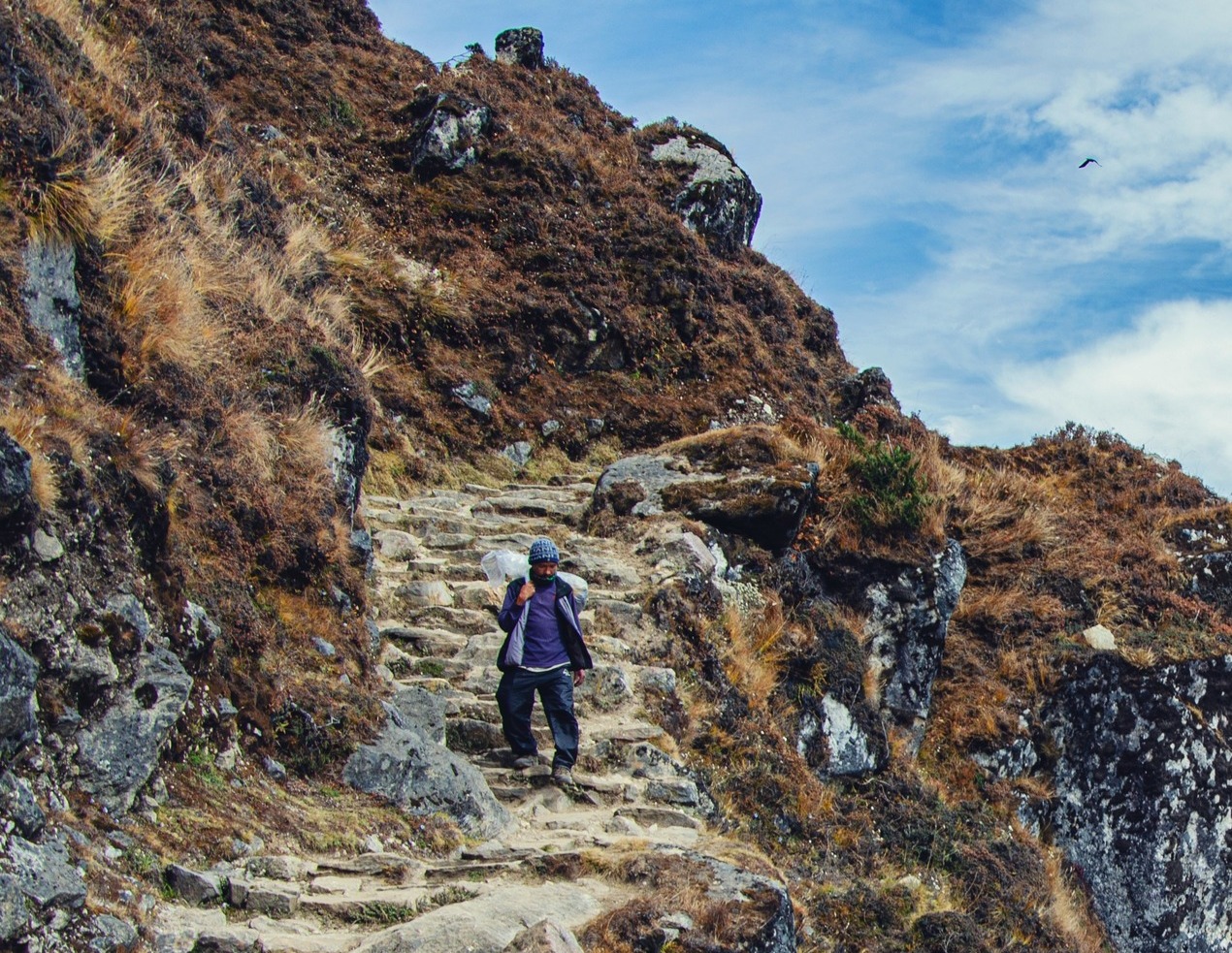 Ours. Cropped. Sherpa on trail on EBC trek, Nepal