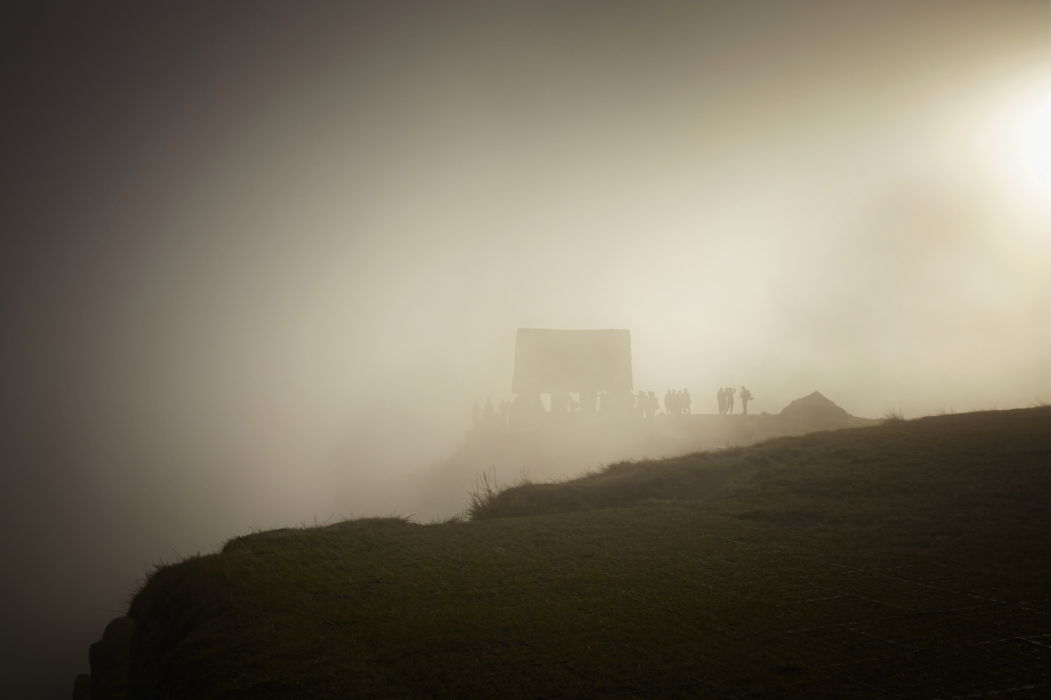 Ours. Fog and sunrise at Machu Picchu, Peru