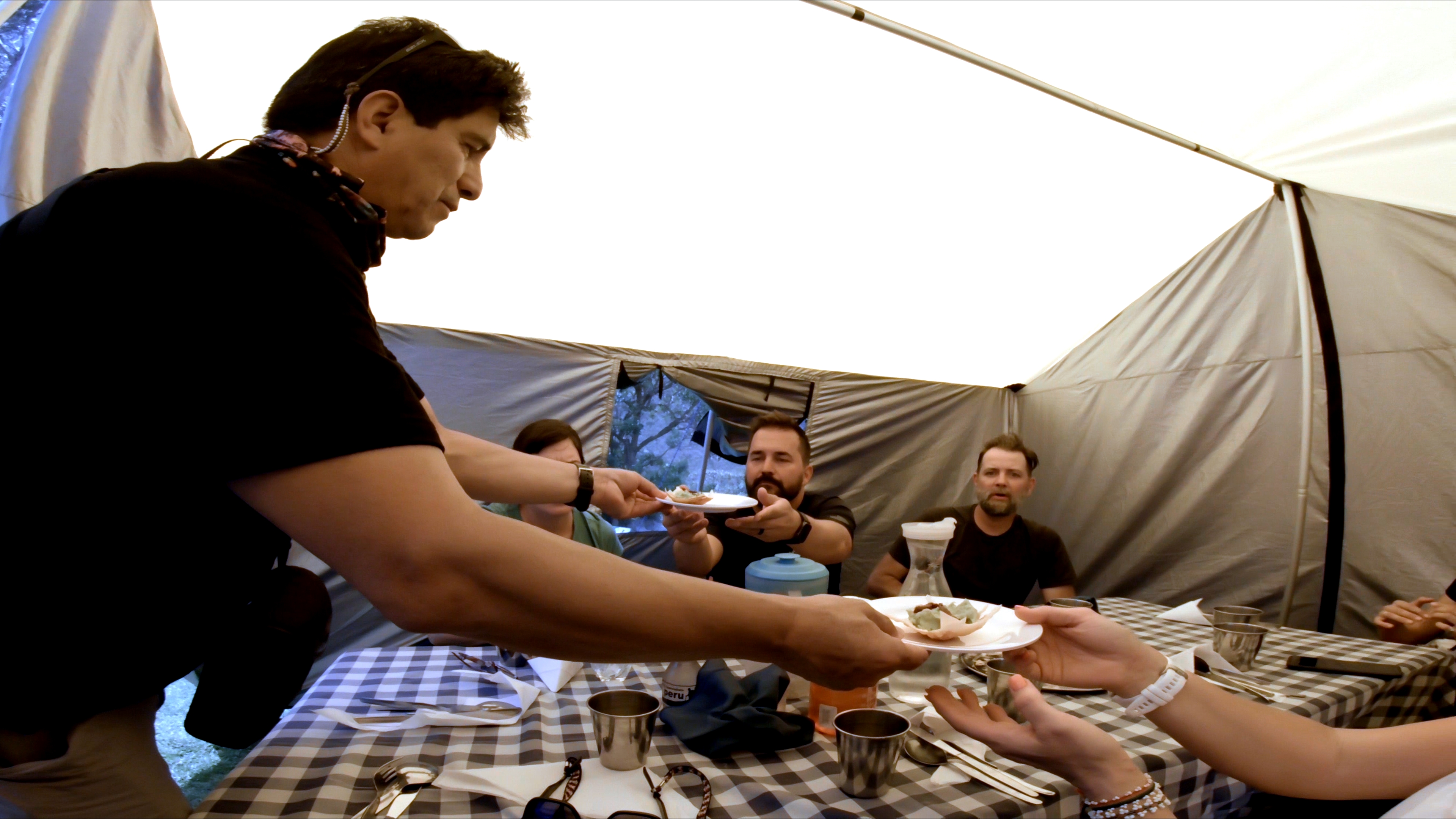 Mario serving food in mess tent on Inca Trail in Peru