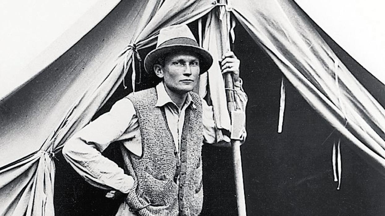 Hiram Bingham by tent, 1912