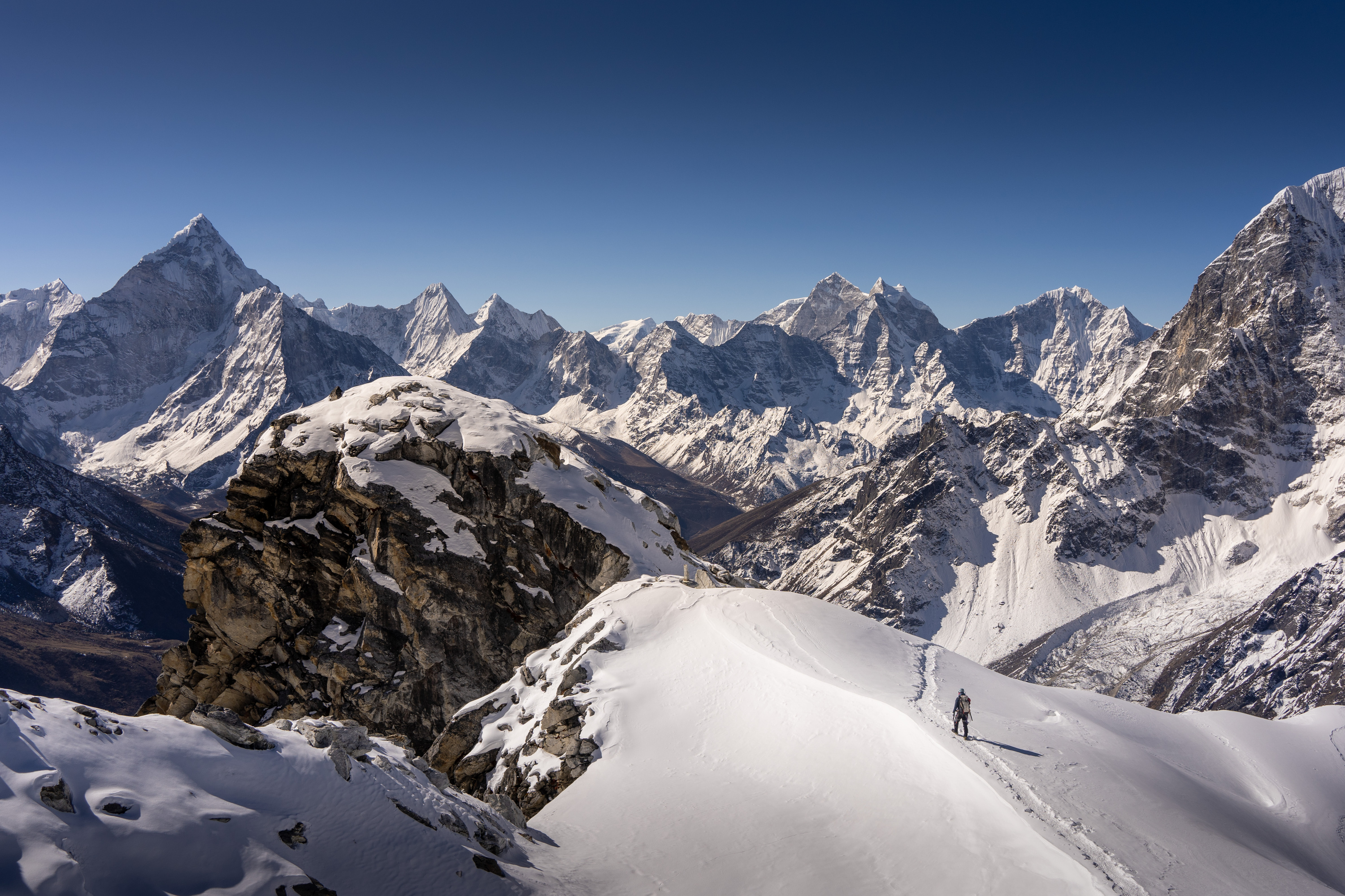 Trekker climber walking down from Lobuche East Peak