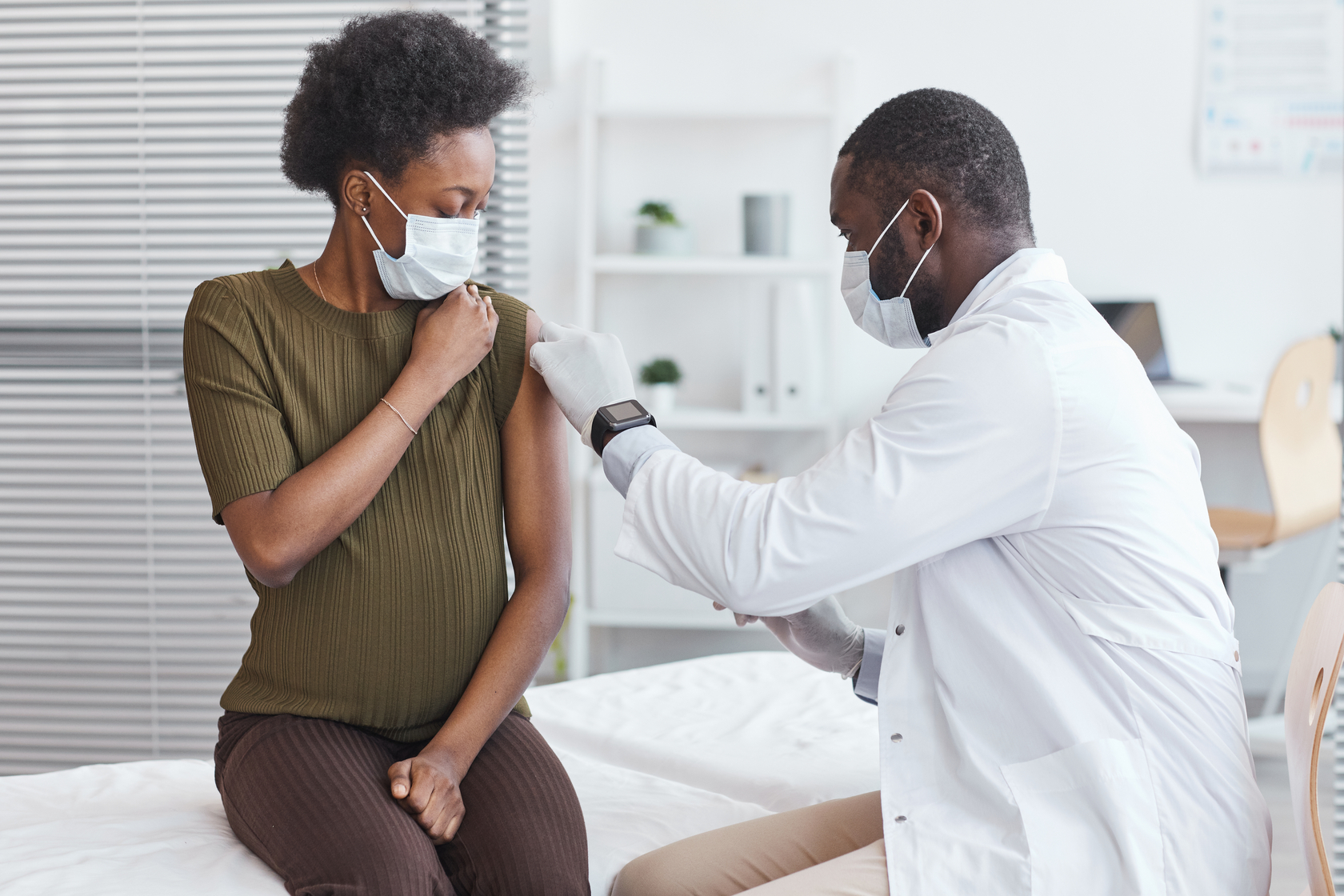 Ours. Woman receiving vaccine injection