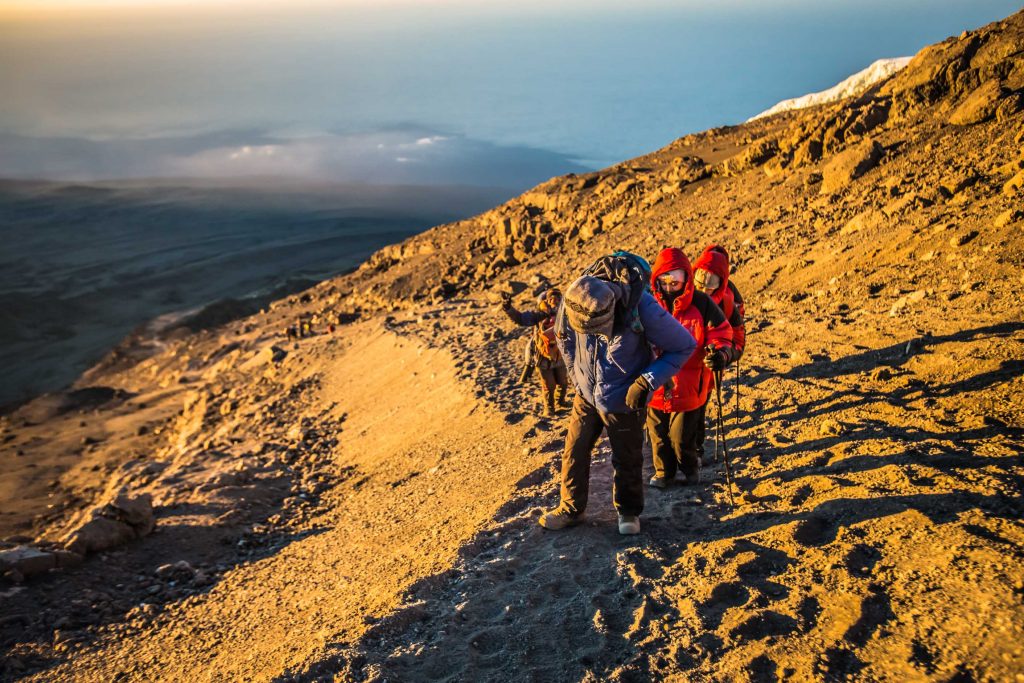 Climbers-with-kilimanjaro-guide-near-the-summit-1024x683.jpg