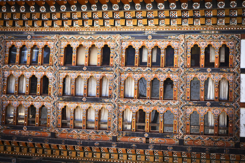 Ours. Windows of Lhuentse Dzong monastery in Eastern Bhutan