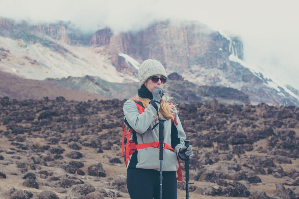 Lady-drinking-of-camel-back-on-kilimanjaro-1024x683.jpg