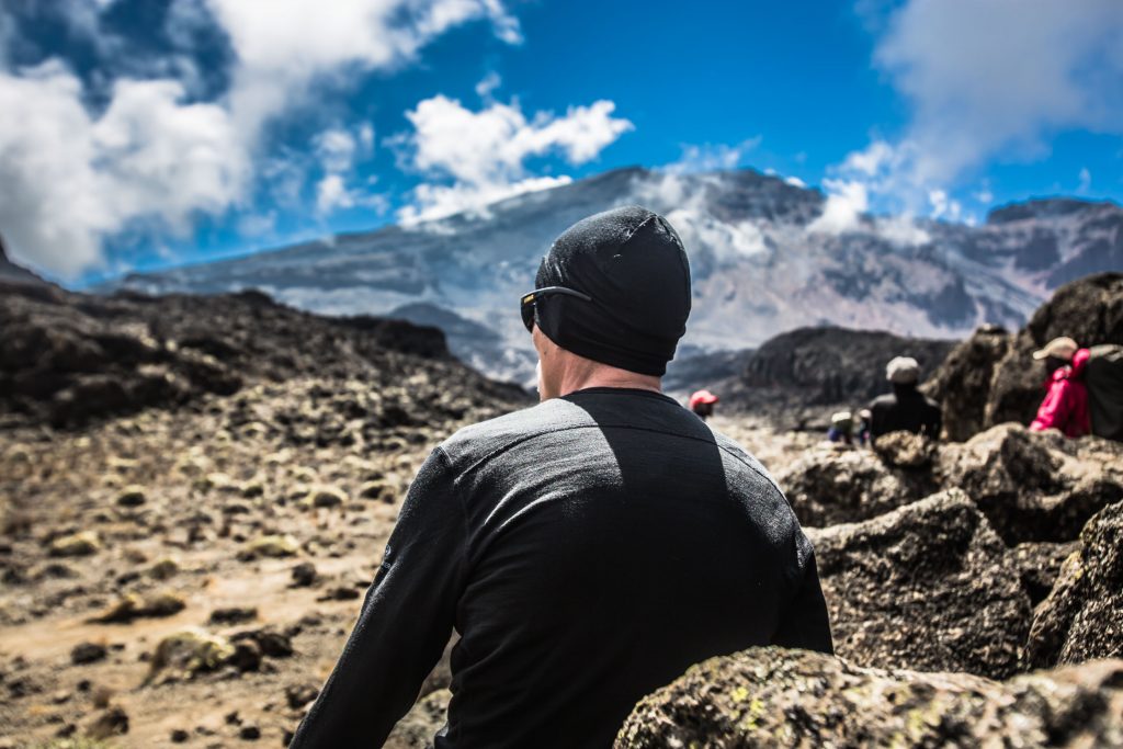 Man-looking-at-the-kilimanjaro-summit-1024x683.jpg