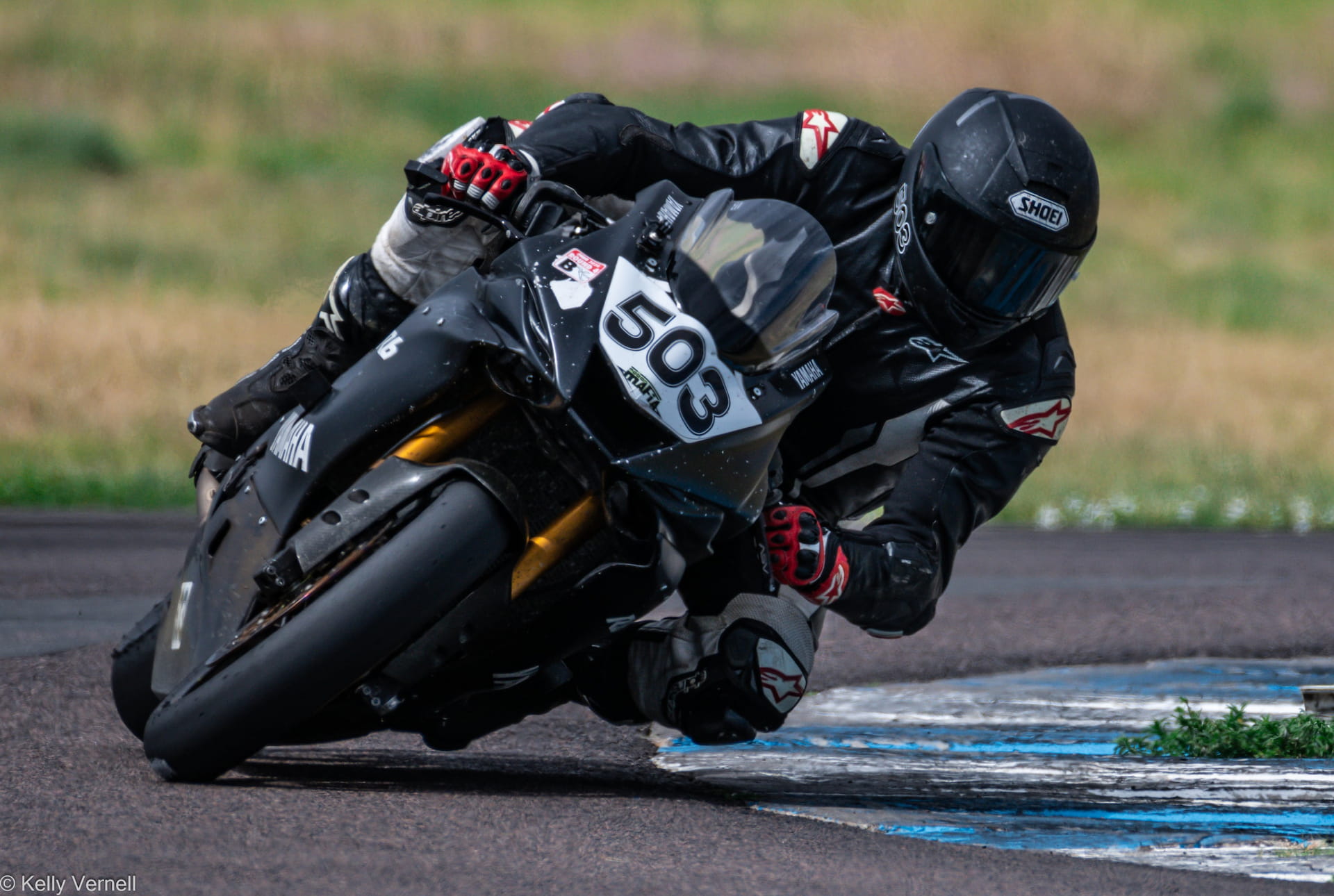 Dylan Unger racing a motorcycle on a track - Venyx Injury Law Denver.