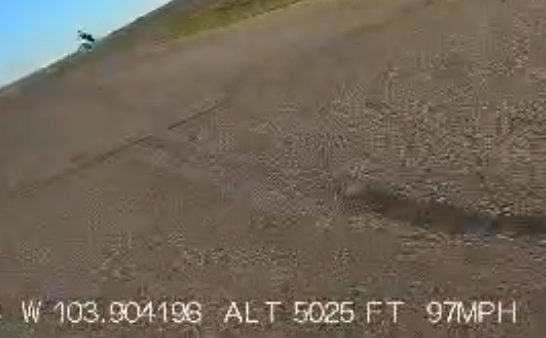GoPro footage from another racer showing motorcycle airborne after crash at High Plains Raceway — 100mph telemetry data visible
