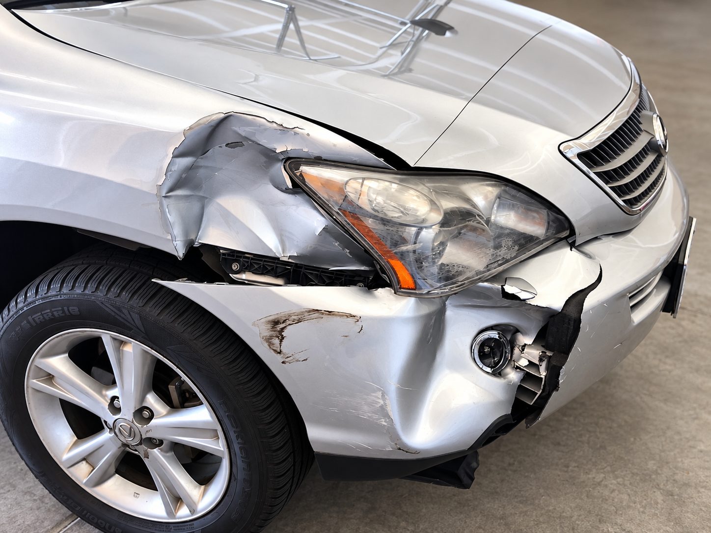 Driver's side damage after a side-swipe collision