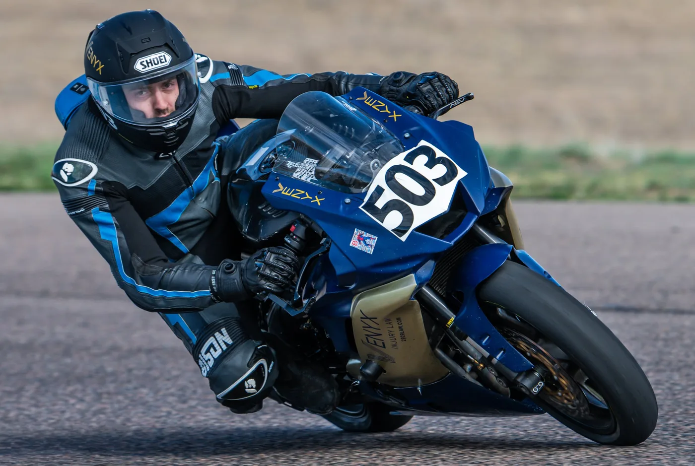 Dylan Unger on bike 503 at full lean during Round 1