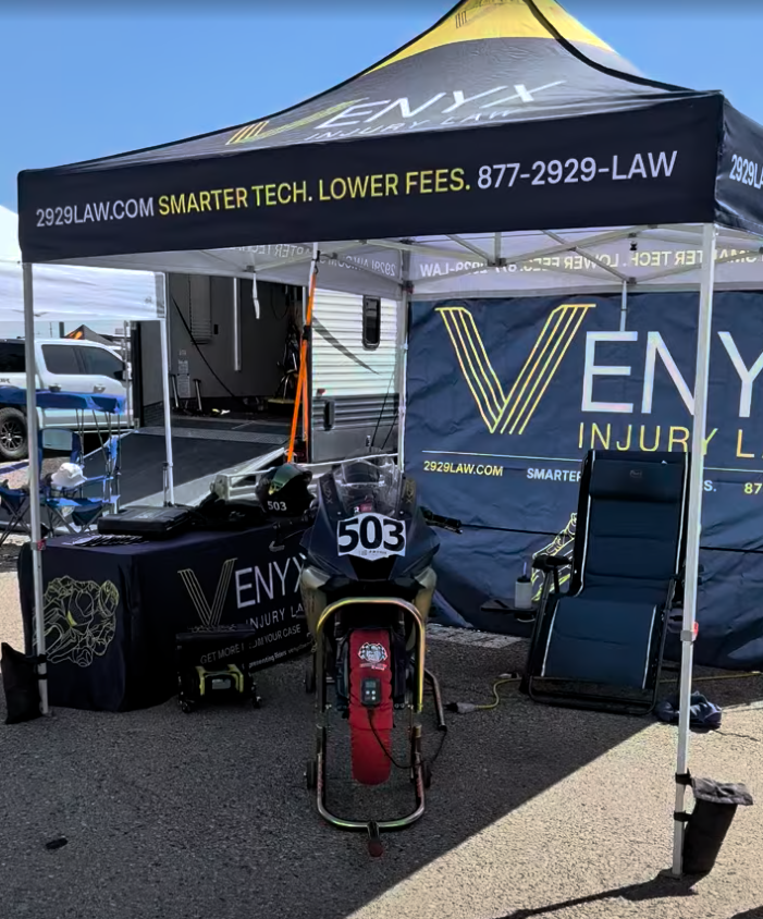 Venyx Law motorcycle accident lawyer race day paddock