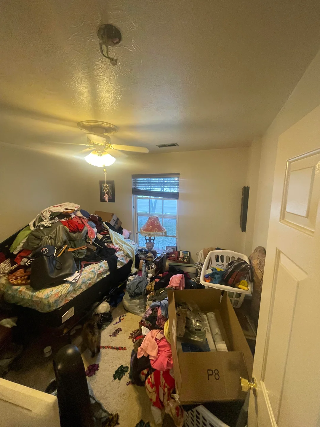 Bathroom sink filled with dirty brown water surrounded by toiletries and a hand towel on a ring in Tucson AZ