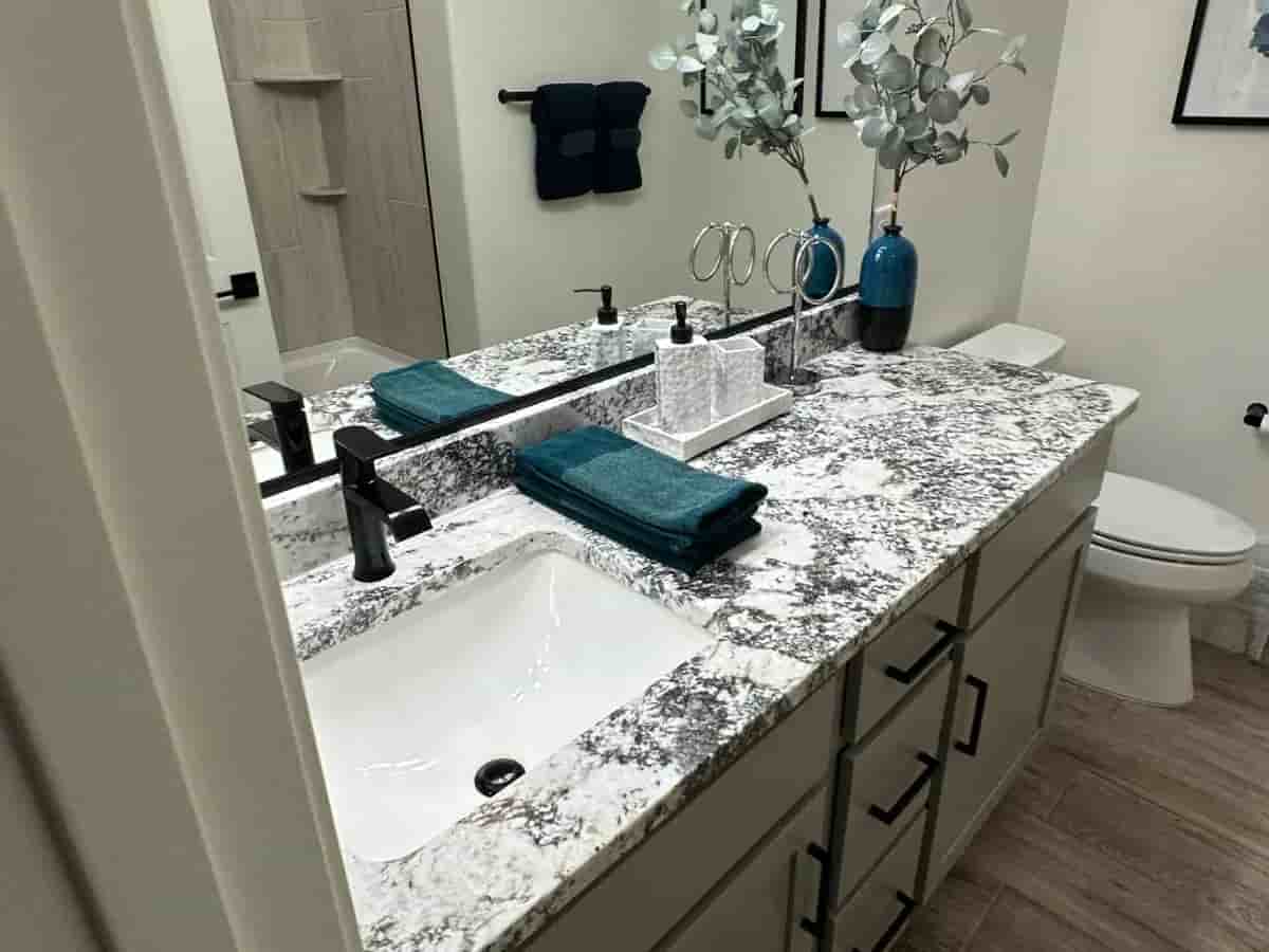Before and after comparison of a bathroom sink; the top half shows a heavily stained, dirty sink surrounded by toiletries, and the bottom half shows the same sink thoroughly cleaned and spotless. Tucson, Arizona