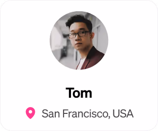 Portrait of a young man named Tom wearing glasses and a maroon jacket, location San Francisco, USA.
