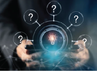 Hands holding device projecting light bulb surrounded by question marks in circles.