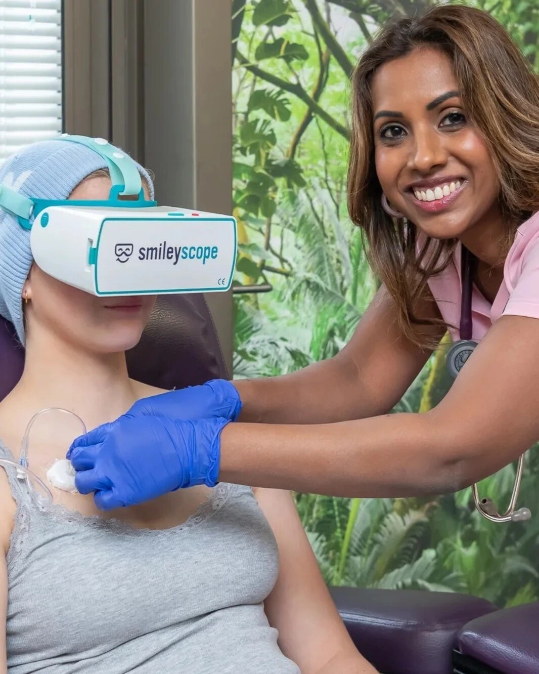 A picture of a nurse fitting VR headset to a patient
