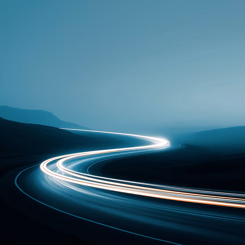 Ethereal light trails illuminate the night road, capturing the allure of speed and sophistication in the darkness.