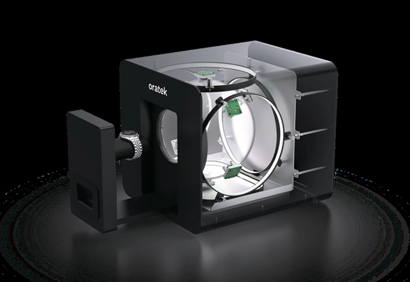 3D rendered cutaway view of a black oratek technology device showing internal circular components and circuit boards.