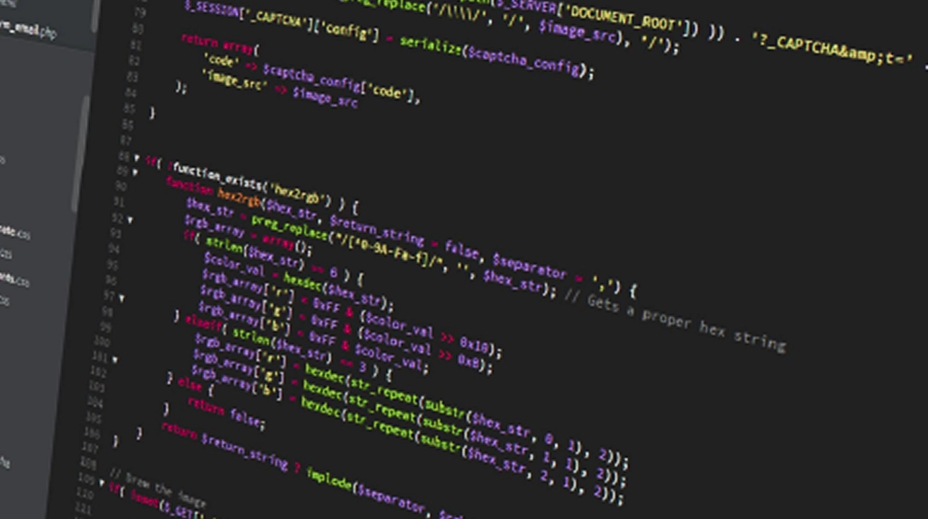 Close-up of computer screen displaying colorful lines of PHP code related to CAPTCHA and hex color processing.