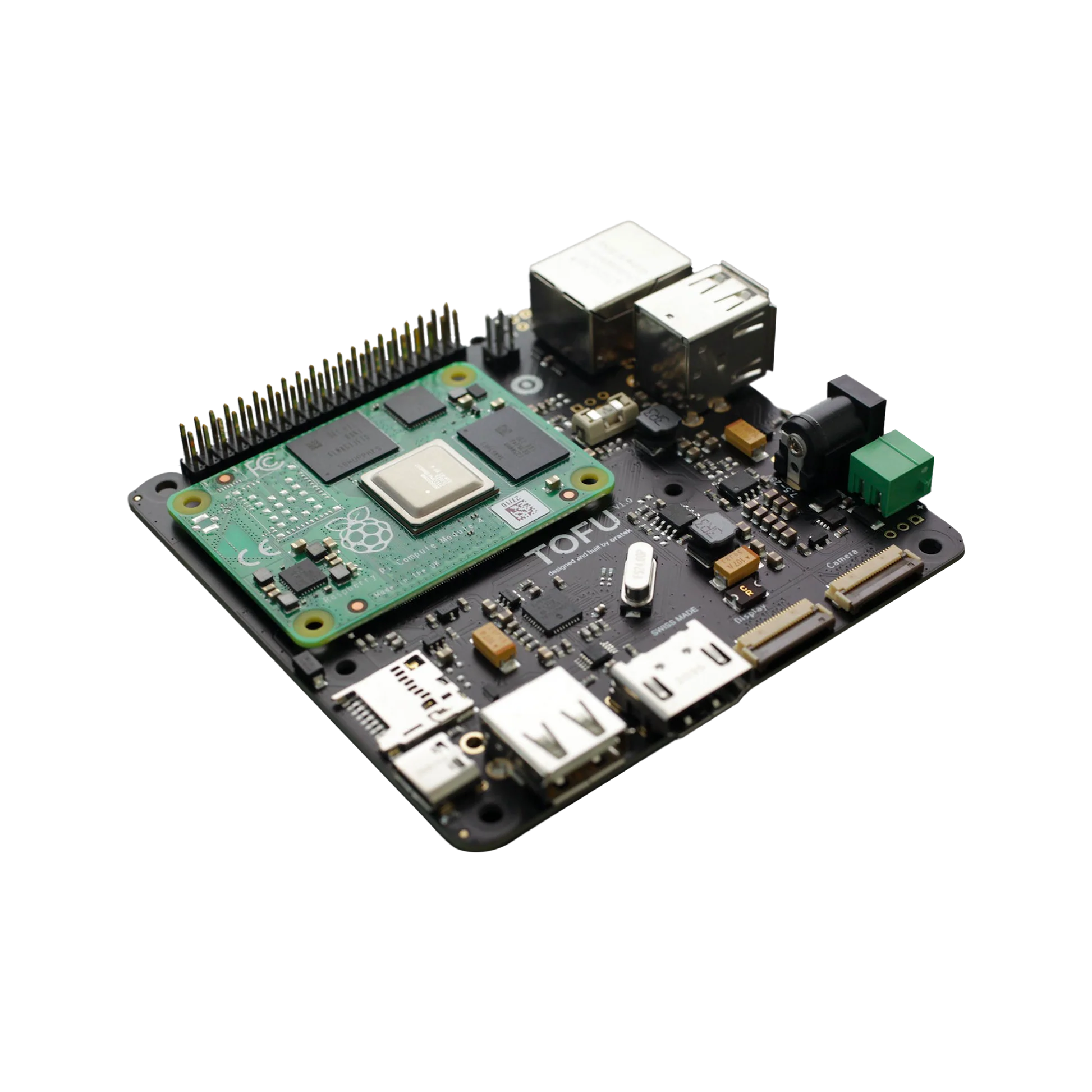 Compact TOFU single-board computer with Raspberry Pi Compute Module mounted on top and multiple USB, Ethernet, and display ports.