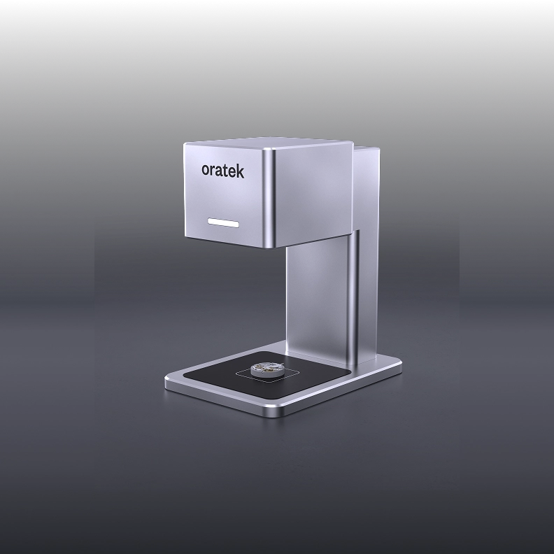Black Oratek watch winder with a wristwatch mounted inside, showing internal rotary mechanism and circuit boards.