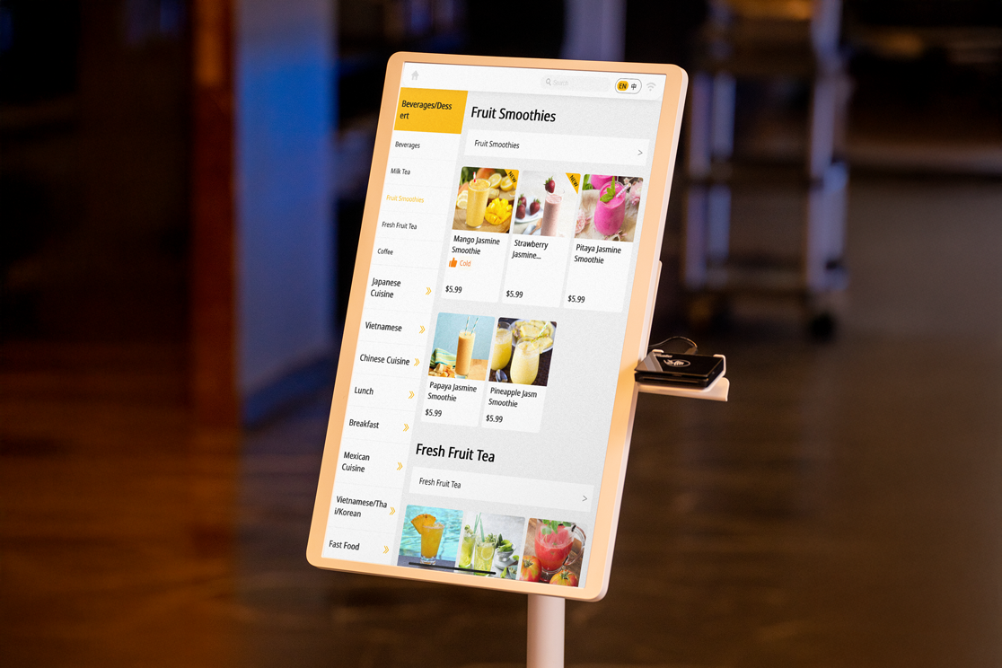 Touchscreen kiosk displays drink selection interface with fruit smoothies for easy and intuitive self-ordering in-store.