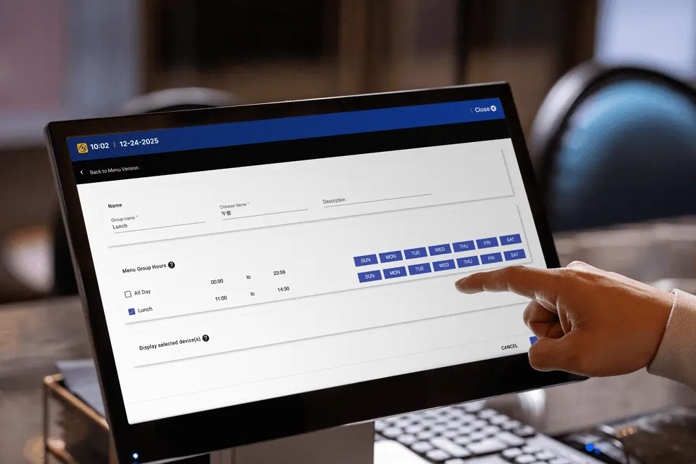 User selects lunch hours by day on a touchscreen interface for smart delivery platform menu scheduling.