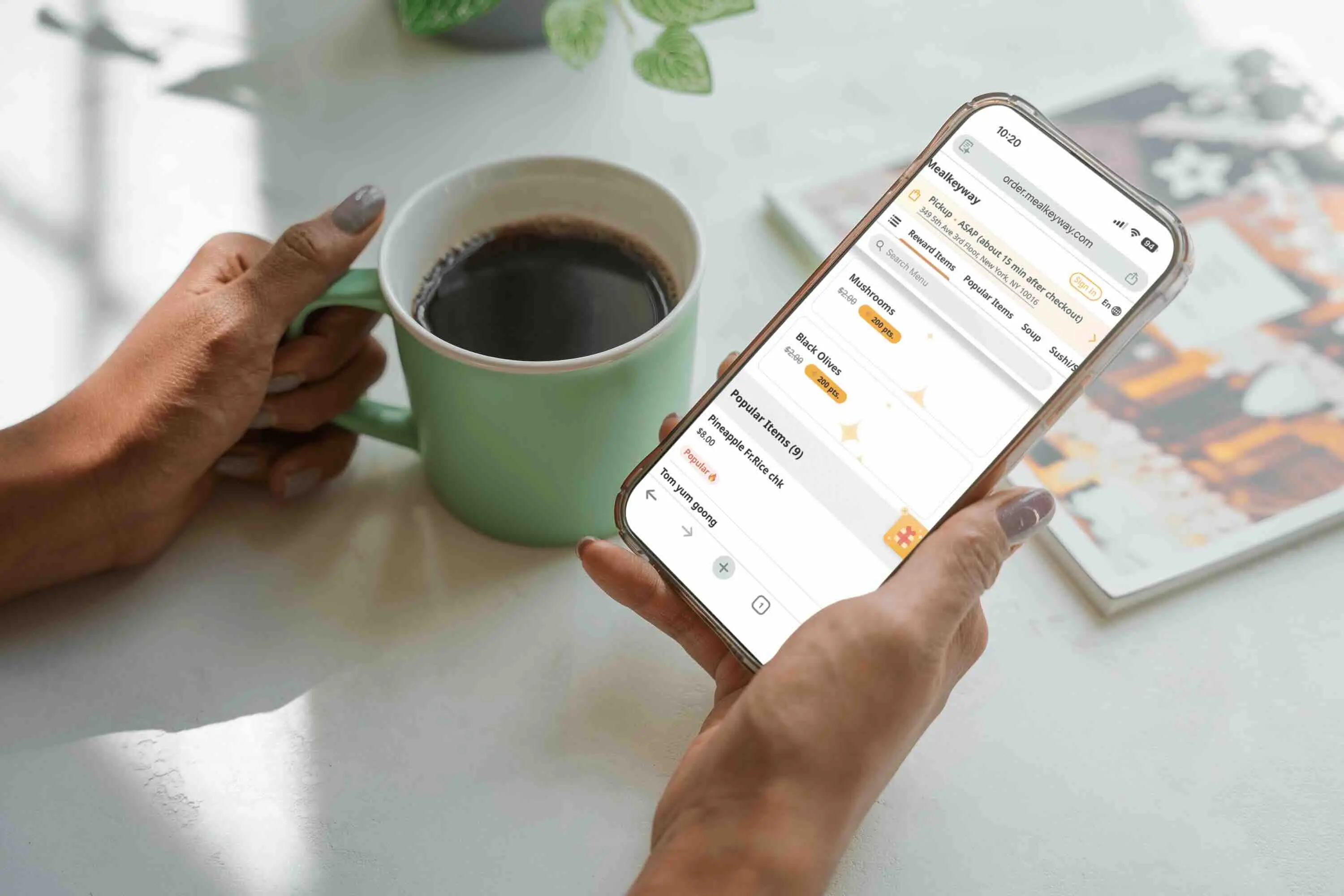 Individual with an iPhone showing an app featuring benefits of online order membership.