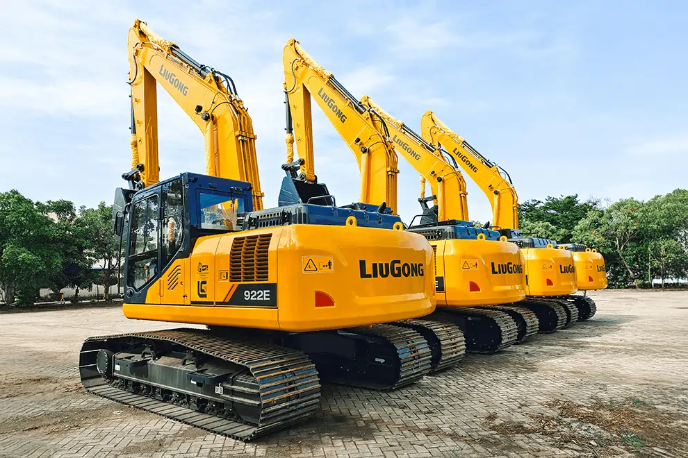Excavation company’s heavy machinery including several LiuGong excavators parked in a row at a job site.