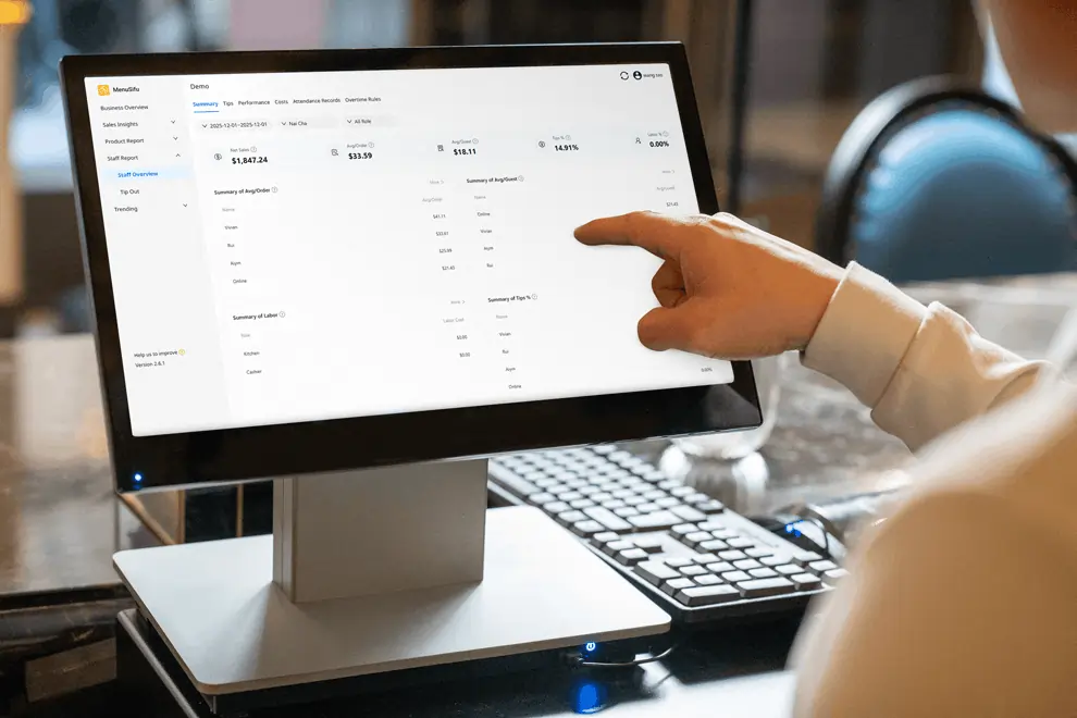 Restaurant manager navigating POS dashboard with detailed summary of sales, tips, and staff performance.