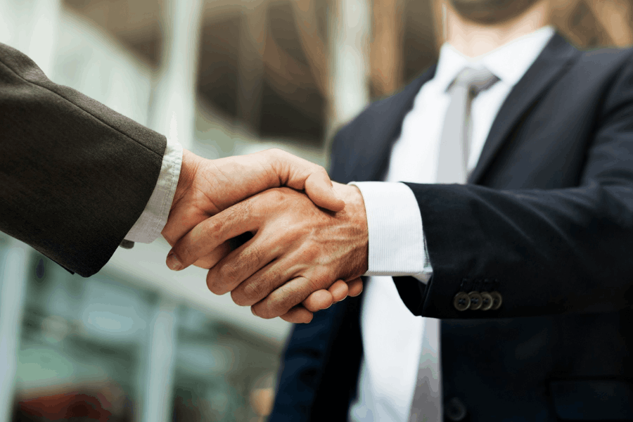 Handshake between business professionals representing WEFOOD’s resource connection services for suppliers and culinary talent.