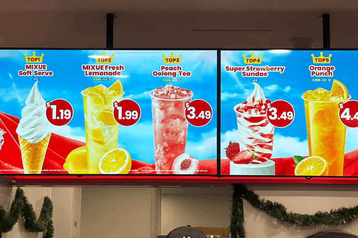 Bright digital promo screen displaying top 5 Mixue drinks and desserts with prices, using vivid visuals and bold text.