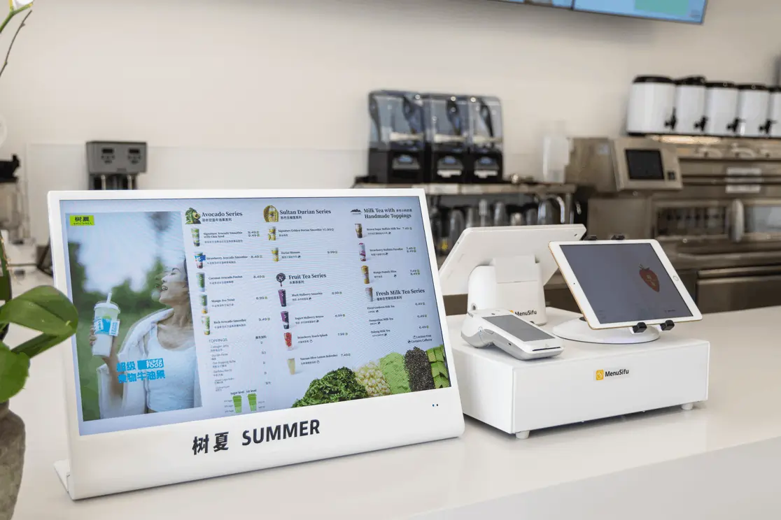 Chinese boba tea shop uses Menusifu POS to display digital menu and process orders with touchscreen devices at the counter.