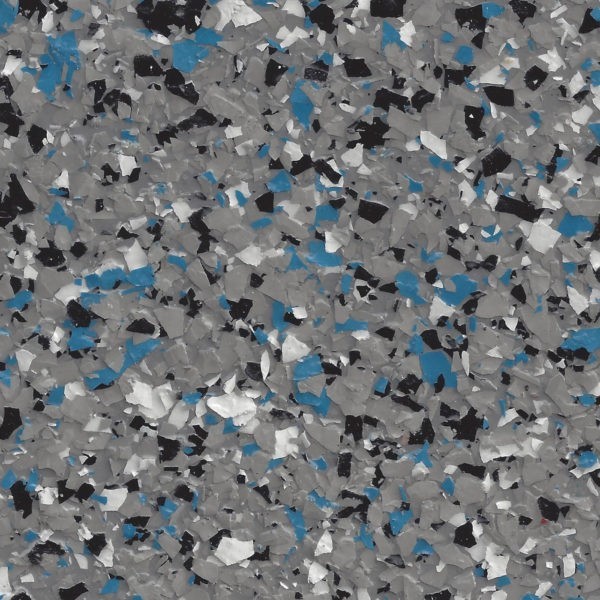 Close-up of epoxy floor coating with gray, blue, black, and white flakes.