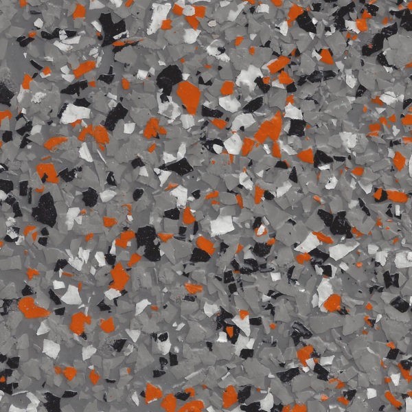 Textured surface with scattered epoxy flakes in ash grey, orange, black, and white colors.